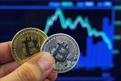 Hình ảnh mô phỏng đồng tiền điện tử Bitcoin. (Ảnh minh họa: AFP/TTXVN)