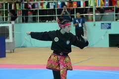 Vận động viên nữ Lào tham gia thi đấu Pencak Silat nội dung biễu diễn. (Ảnh: Văn Dũng/TTXVN)
