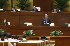Bộ trưởng Bộ Tài chính Hồ Đức Phớc phát biểu giải trình, làm rõ một số vấn đề đại biểu Quốc hội nêu. (Ảnh: Doãn Tấn/TTXVN)