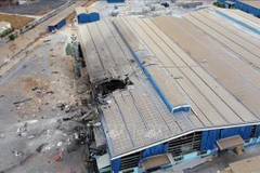 Hiện trường nơi xảy ra vụ nổ lò hơi tại Công ty TNHH gỗ Bình Minh. (Nguồn: TTXVN) 