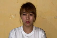 Đối tượng Phan Thị Hồng tại cơ quan Công an. (Ảnh: TTXVN phát)