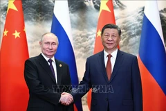 Chủ tịch Trung Quốc Tập Cận Bình (phải) và Tổng thống Nga Vladimir Putin tại cuộc gặp ở Bắc Kinh ngày 16/5/2024. (Ảnh: AFP/TTXVN) 