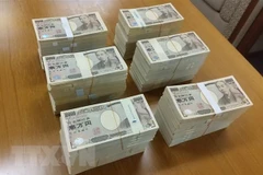 Đồng tiền giấy mệnh giá 10.000 yen Nhật Bản. (Ảnh: AFP/TTXVN) 