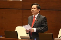 Bộ trưởng Bộ Giao thông Vận tải Nguyễn Văn Thể trả lời chất vấn. (Ảnh: Doãn Tấn/TTXVN)
