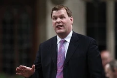 Ngoại trưởng Canada John Baird. (Ảnh: Reuters).