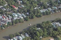 Nhà ven sông rạch ở thành phố Cần Thơ. (Nguồn: TTXVN)