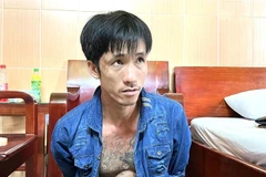 Đối tượng Nguyễn Minh Tâm bị công an bắt giữ. (Ảnh : TTXVN phát)