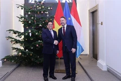Thủ tướng Chính phủ Phạm Minh Chính và Thủ tướng Luxembourg Xavier Bettel. (Ảnh: Dương Giang/TTXVN)