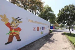 Pano quảng bá cho SEA Games 31 bên ngoài Cung Điền kinh Hà Nội. (Ảnh: Hoàng Hiếu/TTXVN)