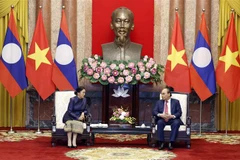 Chủ tịch nước Nguyễn Xuân Phúc tiếp Phó Chủ tịch nước CHDCND Lào Pany Yathotou ngày 26/04/2022 tại Hà Nội. (Ảnh: Thống Nhất/TTXVN)