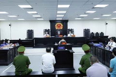 Quang cảnh phiên tòa. (Ảnh: An Đăng/TTXVN)