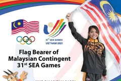 "Kình ngư" Olympic Nur Dhabitah Sabri mang cờ của Malaysia tại SEA Games. (Nguồn: ocasia.org)