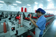 Sản xuất dệt nhuộm tại Công ty TNHH Dệt nhuộm Jasan Việt Nam có vốn đầu tư Trung Quốc (Khu công nghiệp dệt may Phố Nối B, Liêu Xá, Yên Mỹ, Hưng Yên). (Ảnh: Phạm Kiên/TTXVN)