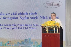 Ông Nguyễn Đức Lệnh, Phó giám đốc Ngân hàng Nhà nước Việt Nam Chi nhánh TP. Hồ Chí Minh cập nhật việc triển khai Nghị định 31/2022/NĐ-CP. (Ảnh: Mỹ Phương/TTXVN)