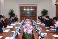 Ông Nguyễn Văn Bình, Ủy viên Bộ Chính trị, Bí thư Trung ương Đảng,Trưởng Ban Kinh tế Trung ương tiếp Đoàn đại biểu cấp cao Đảng Hành động nhân dân Singapore (PAP). (Ảnh: Phương Hoa/TTXVN)