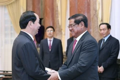  Chủ tịch nước Trần Đại Quang tiếp Ngài Sar Kheng, Phó Thủ tướng, Bộ trưởng Bộ Nội vụ Vương quốc Campuchia. (Ảnh: Nhan Sáng/TTXVN)