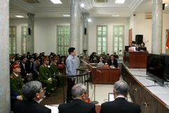 Quang cảnh phiên xét xử. (Ảnh: Phạm Kiên/TTXVN)