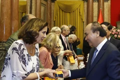 Hình ảnh Chủ tịch nước Nguyễn Xuân Phúc với các đại biểu (Ảnh: Thống Nhất/TTXVN) 