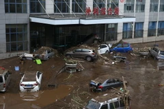 Cảnh ngập lụt sau những trận mưa lớn. (Ảnh: AFP/TTXVN)