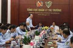 Ký kết Chương trình hợp tác giữa Bộ Tài chính và Bộ Công Thương. (Ảnh: Đức Duy/Vietnam+)