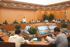 Cuộc họp của Ban Chỉ đạo COVID-19 thành phố Hà Nội. (Ảnh: PV/Vietnam+)