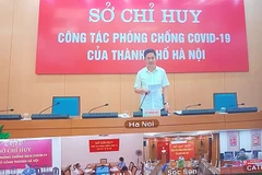 Ông Hà Minh Hải, Phó Chủ tịch UBND thành phố Hà Nội họp với các quận, huyện về công tác phòng chống dịch bệnh. (Ảnh: PV/Vietnam+)