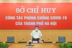 Ông Chu Ngọc Anh, Chủ tịch Ủy ban nhân dân thành phố phát biểu tại cuộc họp. (Ảnh: PV/Vietnam+)