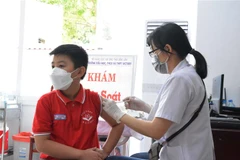 Tiêm vaccine cho học sinh tại Trường Tiểu học, THCS và THPT Victory (TP Buôn Ma Thuột. (Ảnh: Tuấn Anh/TTXVN)