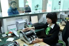 Vietcombank hạ lãi suất huy động lần thứ 5 trong năm 2014