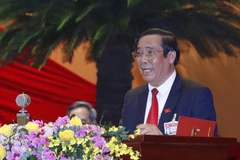 Đồng chí Nguyễn Thanh Bình, Phó Trưởng ban Thường trực Ban Tổ chức Trung ương khóa XII thay mặt Ban Kiểm phiếu Đại hội báo cáo kết quả bầu cử, công bố danh sách các đồng chí trúng cử vào Ban Chấp hành Trung ương khóa XIII. (Ảnh: TTXVN)