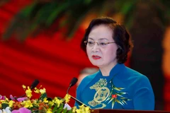 Đồng chí Phạm Thị Thanh Trà, Ủy viên Trung ương Đảng, Phó Trưởng ban Tổ chức Trung ương, Thứ trưởng Bộ Nội vụ trình bày tham luận. (Ảnh: TTXVN)