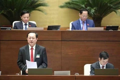 Bộ trưởng Bộ Khoa học và Công nghệ Huỳnh Thành Đạt trả lời chất vấn. (Ảnh: Minh Đức/TTXVN)