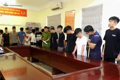 Cơ quan công an làm việc với các đối tượng có liên quan. (Ảnh: TTXVN phát)