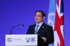 Thủ tướng Phạm Minh Chính phát biểu tại Hội nghị Thượng đỉnh khí hậu trong khuôn khổ Hội nghị lần thứ 26 các Bên tham gia Công ước khung của Liên hợp quốc về Biến đổi khí hậu (COP26). (Ảnh: Dương Giang/TTXVN)
