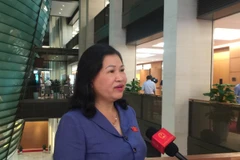 Đại biểu Phương Thị Thanh, đoàn Bắc Kạn trả lời phỏng vấn về dự án Luật sửa đổi, bổ sung một số điều của Luật Tổ chức Chính phủ và Luật Tổ chức chính quyền địa phương. (Ảnh: PV/Vietnam+)