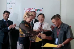 Quang cảnh lễ ký thỏa thuận. (Ảnh: Xuân Khu/Vietnam+)