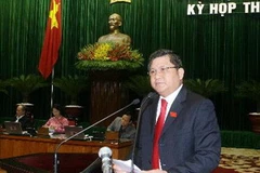 Chủ nhiệm Ủy ban Kinh tế của Quốc hội Nguyễn Văn Giàu trình bày Báo cáo của Ủy ban Thường vụ Quốc hội về kết quả giám sát. (Ảnh: Thống Nhất/TTXVN)