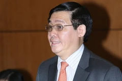 Bộ trưởng Bộ Tài chính Vương Đình Huệ trình bày tờ trình tại phiên họp. (Ảnh: Phương Hoa/TTXVN)