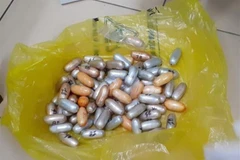 Số cocain, được bọc dưới dạng viên nén, bị lực lượng Hải quan Thành phố Hồ Chí Minh phát hiện, thu giữ. (Ảnh: TTXVN)