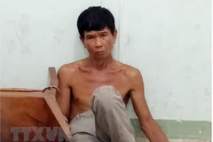 Đối tượng Phan Minh Cường tại cơ quan điều tra. (Ảnh: Công Thử/TTXVN)