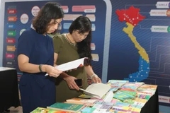 Những ấn phẩm in lậu. (Ảnh: Thanh Tùng/TTXVN)