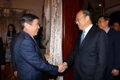 Ông Nguyễn Thành Phong, Chủ tịch Ủy ban nhân dân Thành phố Hồ Chí Minh tiếp ông Nguyễn Thành Phát, Tỉnh trưởng Vân Nam (Trung Quốc) đang có chuyến thăm và làm việc tại Việt Nam. (Ảnh: Thanh Vũ/TTXVN)