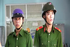 Hai đối tượng Nguyễn Gia Thuận và Nguyễn Hữu Nghĩa. (Ảnh: Thanh Tân/TTXVN)