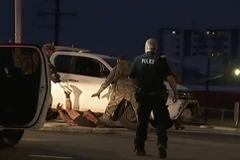 Cảnh sát bắt giữ nghi phạm tại hiện trường vụ xả súng ở Darwin, Australia, ngày 4/6/2019. (Ảnh: AP/TTXVN)