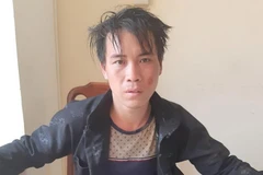 Đối tượng Lù Mí Mua tại cơ quan công an. (Ảnh: TTXVN)