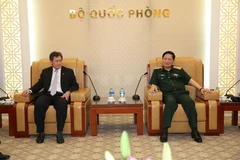 Đại tướng Ngô Xuân Lịch và Tổng Thư ký ASEAN Lim Jock Hoi tại buổi tiếp. (Ảnh: Thông tấn Quân sự)