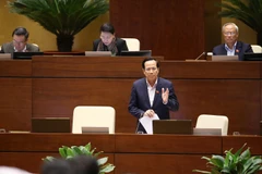 Bộ trưởng Bộ Lao động-Thương binh và Xã hội Đào Ngọc Dung phát biểu, làm rõ một số vấn đề đại biểu Quốc hội nêu. (Ảnh: Dương Giang/TTXVN)