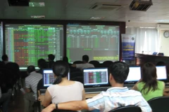 Toàn thị trường có 628 mã tăng, 796 mã đi ngang và 184 mã giảm. (Ảnh: Vietnam+)