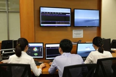 Phần lớn trái phiếu có rủi ro cao thuộc về các doanh nghiệp liên quan đến khối bất động sản hoặc xây dựng với dòng tiền yếu, tỷ lệ vay nợ cao và nguồn tiền mặt để trả nợ đến hạn rất hạn chế. (Ảnh: Vietnam+)