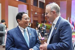 Thủ tướng Phạm Minh Chính trao đổi với Thủ tướng Australia Anthony Albanese tại Hội nghị Cấp cao ASEAN-Australia lần thứ 3. (Ảnh: Dương Giang/TTXVN)